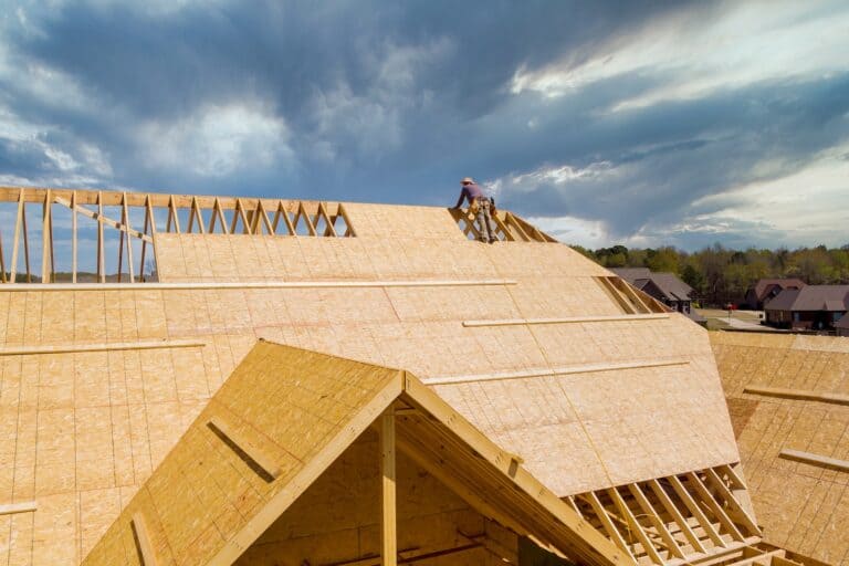 Home roof construction site working on the roof sheeting